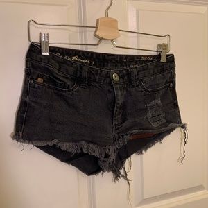low waisted distressed black denim shorts
